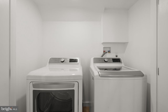 washroom with washing machine and dryer