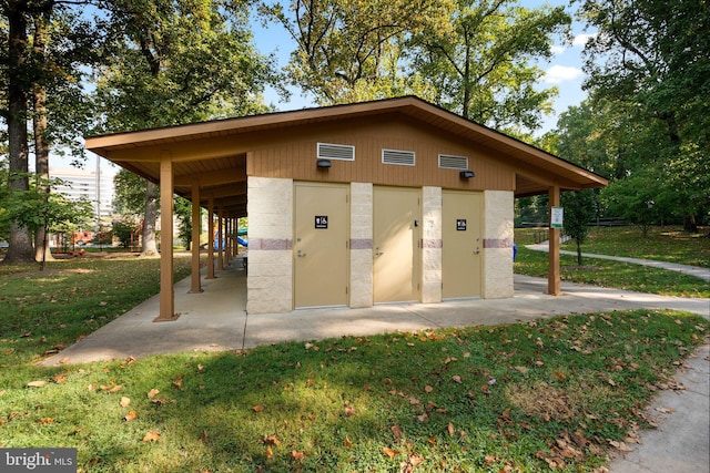 view of property's community with a yard