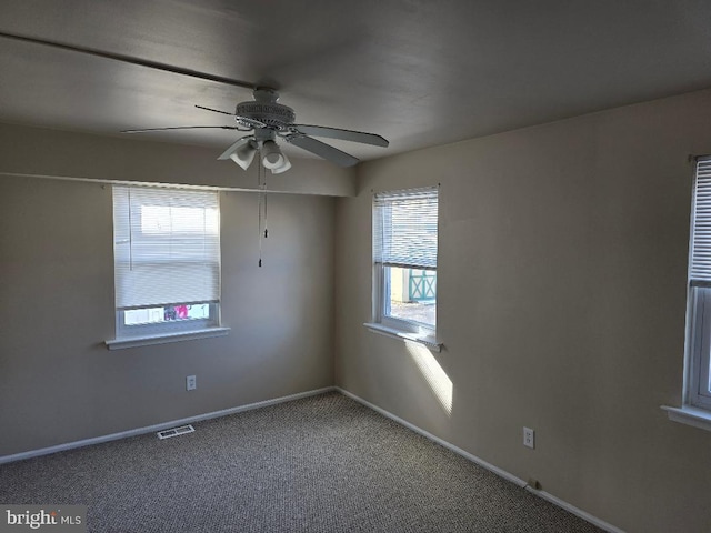 empty room with carpet and ceiling fan