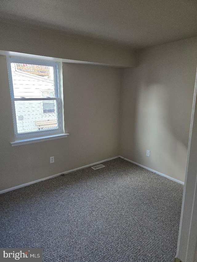 view of carpeted spare room