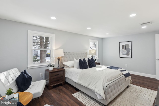 bedroom featuring dark hardwood / wood-style flooring