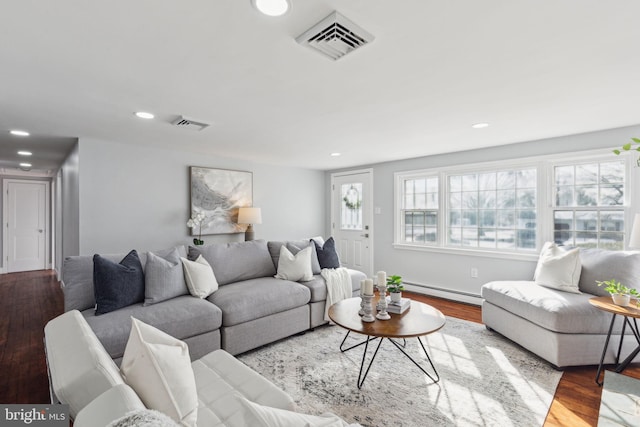 living room featuring light hardwood / wood-style floors and a baseboard radiator