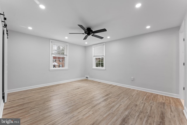 unfurnished room featuring ceiling fan and light hardwood / wood-style floors