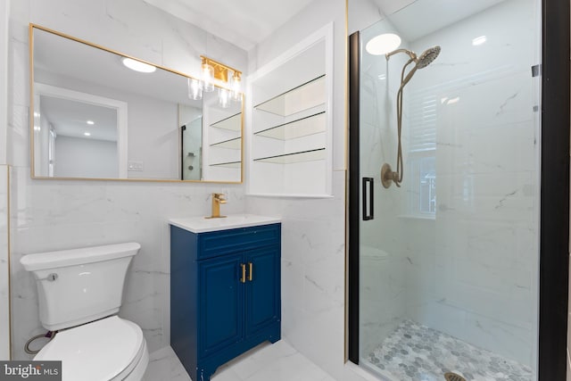 bathroom with toilet, an enclosed shower, vanity, and tile walls