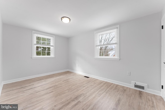 unfurnished room featuring light hardwood / wood-style floors