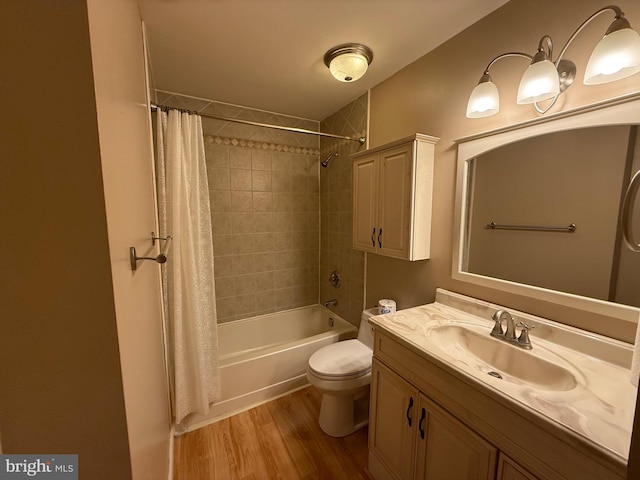 full bathroom featuring vanity, wood-type flooring, shower / bath combo, and toilet