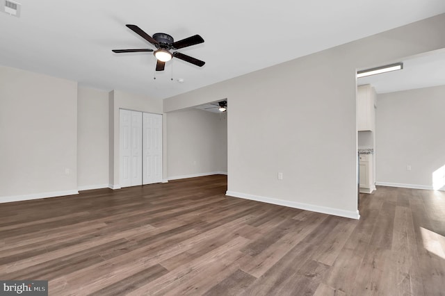 unfurnished room with ceiling fan and wood-type flooring