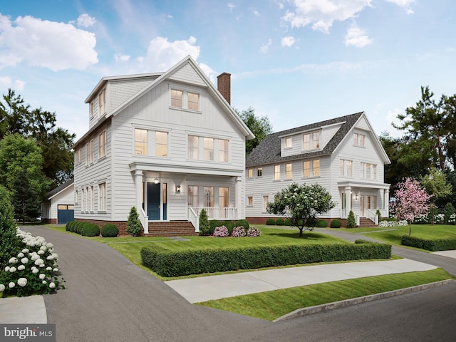 modern farmhouse featuring a front yard and a porch