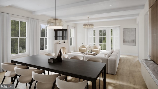 dining room featuring beam ceiling, light hardwood / wood-style floors, an inviting chandelier, and a healthy amount of sunlight