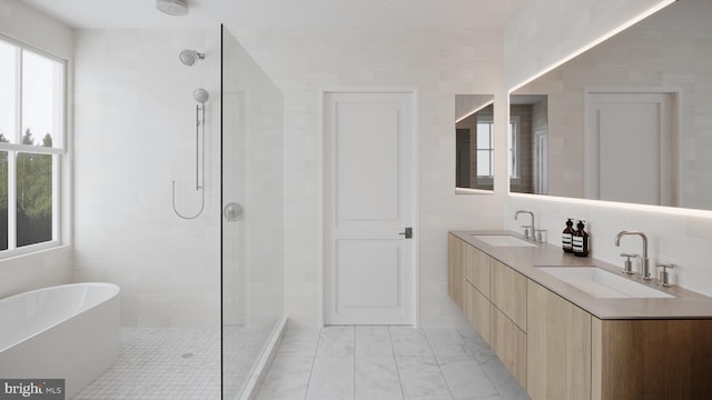 bathroom with vanity, separate shower and tub, and tile walls