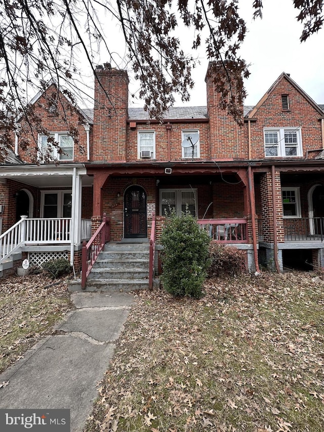 townhome / multi-family property featuring a porch