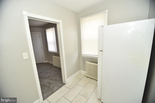 bathroom featuring tile patterned floors and radiator heating unit