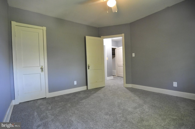 unfurnished bedroom with ceiling fan and carpet floors