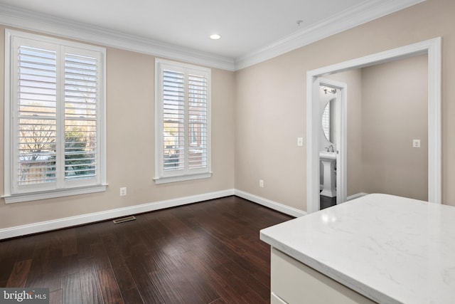 interior space with ornamental molding and dark hardwood / wood-style floors