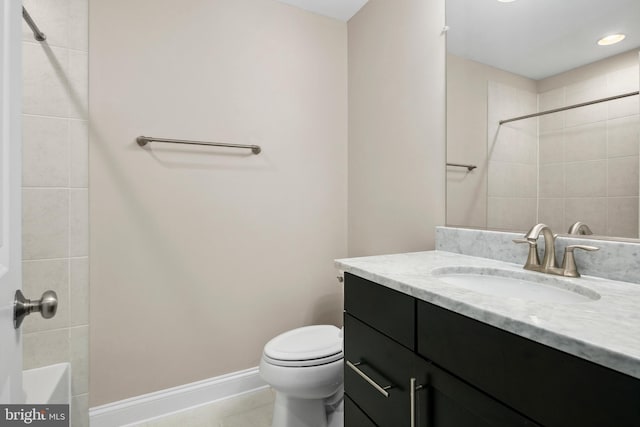 bathroom featuring tile patterned flooring, vanity, and toilet