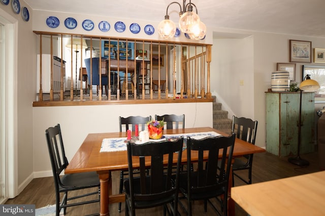 dining area featuring dark wood-type flooring