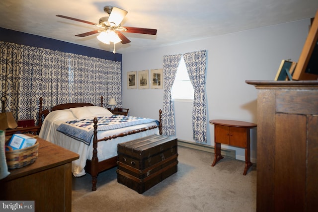 carpeted bedroom with baseboard heating and ceiling fan