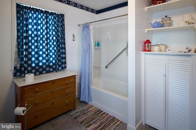 bathroom featuring tile patterned floors and shower / bath combo with shower curtain