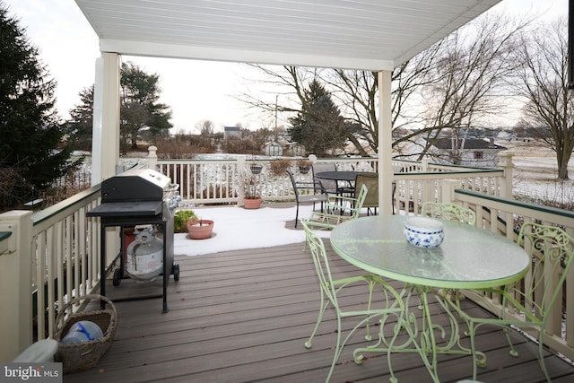 wooden terrace featuring area for grilling