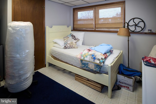 bedroom with a paneled ceiling