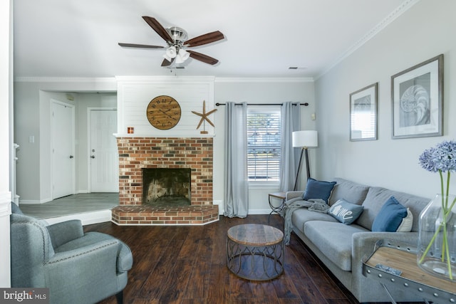 living room with ceiling fan, ornamental molding, a fireplace, and wood-type flooring