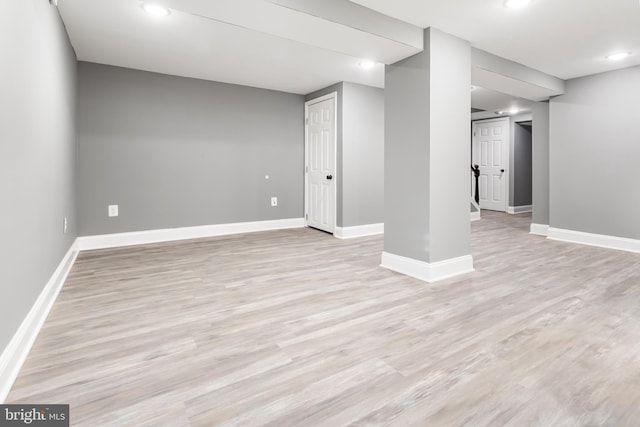 basement featuring light hardwood / wood-style floors