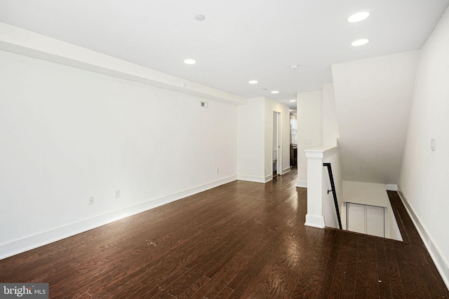 spare room featuring dark wood-type flooring