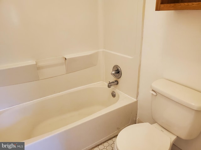 bathroom with toilet and tub / shower combination