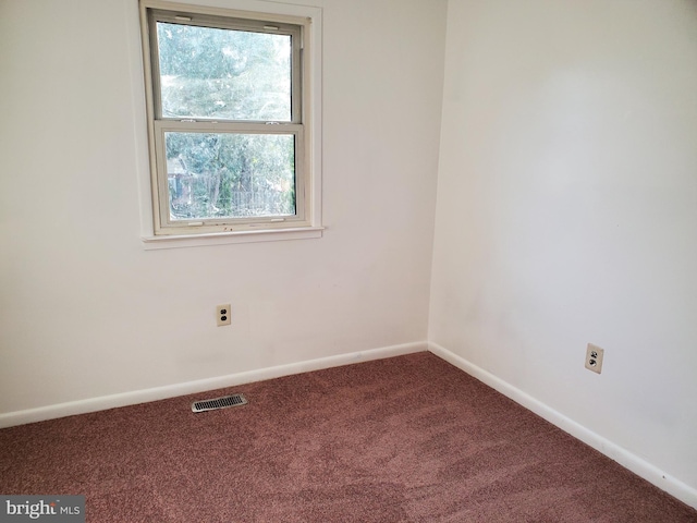 spare room with carpet