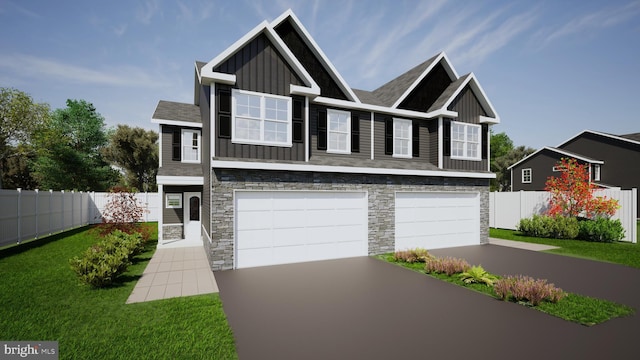 view of front of home featuring a front lawn, a garage, fence, and board and batten siding