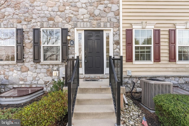 property entrance featuring cooling unit