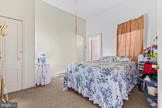 bedroom featuring carpet flooring and a baseboard heating unit