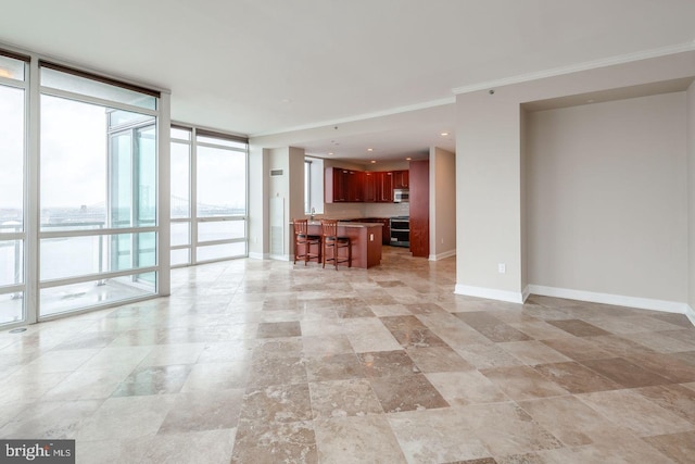 unfurnished living room with expansive windows and crown molding