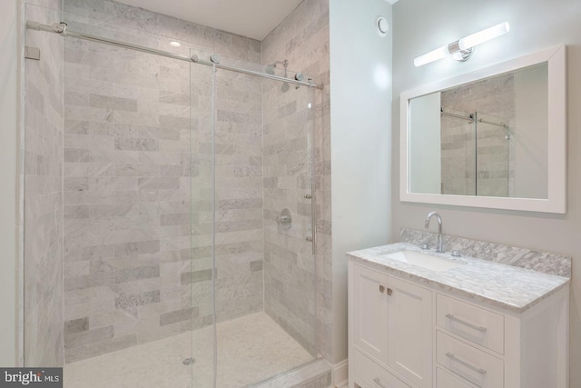 bathroom with vanity and an enclosed shower