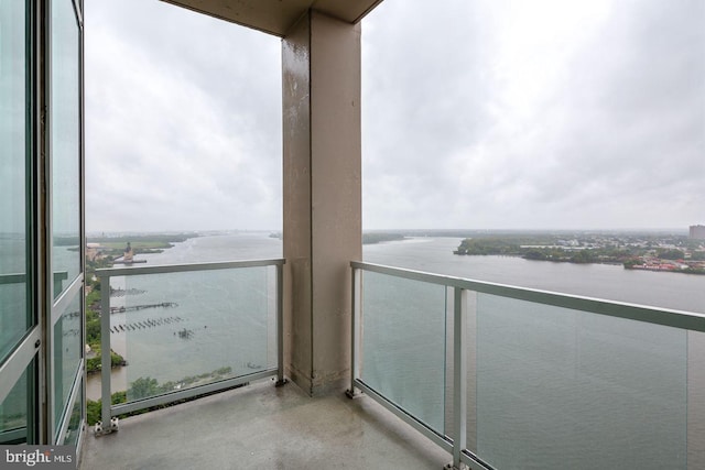 balcony featuring a water view