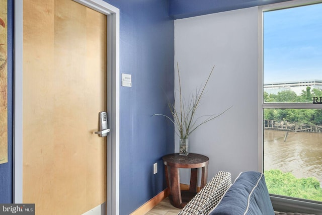 interior space featuring baseboards and wood finished floors