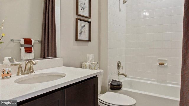 full bathroom featuring vanity, shower / tub combo, and toilet