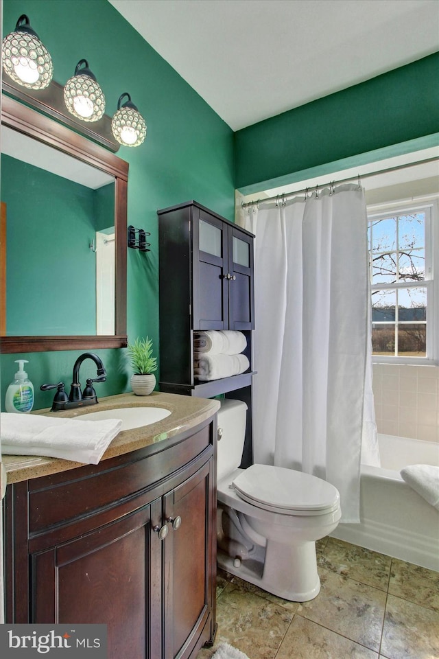 full bathroom featuring shower / tub combo, vanity, toilet, and tile patterned floors