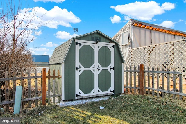 view of shed with a fenced backyard