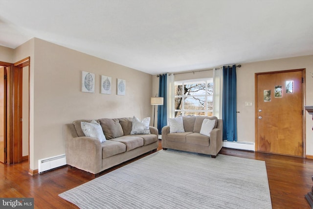 living room featuring baseboards, a baseboard heating unit, and wood finished floors