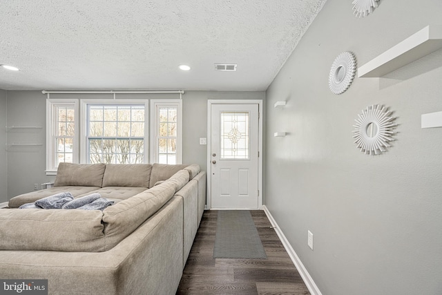 living room with a textured ceiling