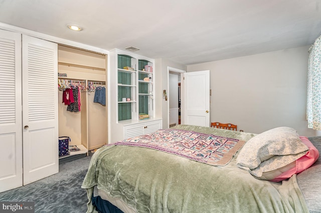 carpeted bedroom featuring a closet