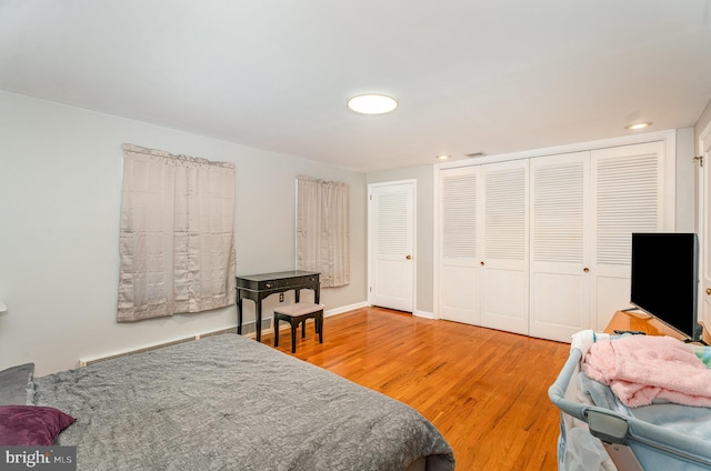 bedroom with hardwood / wood-style flooring