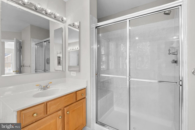 bathroom with vanity and a shower stall