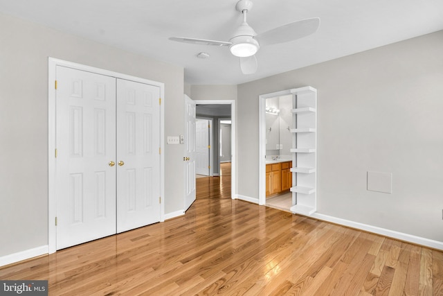 unfurnished bedroom with a ceiling fan, baseboards, a closet, and light wood finished floors