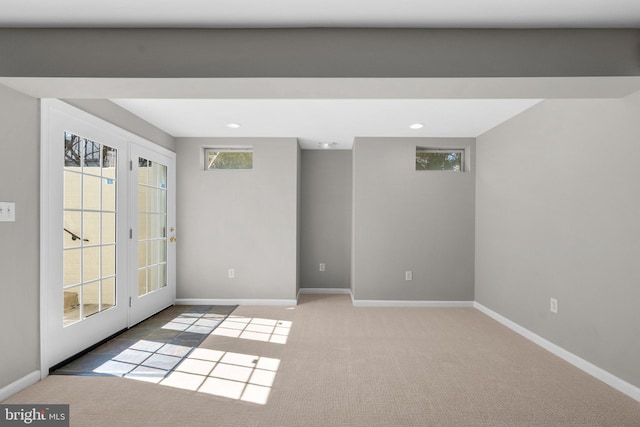 spare room with recessed lighting, french doors, baseboards, and carpet floors