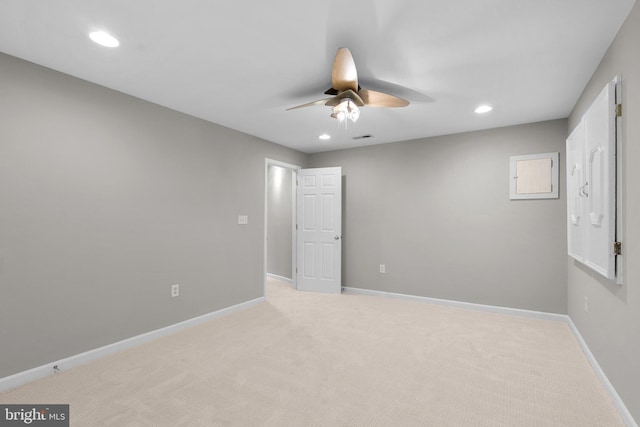 carpeted empty room featuring recessed lighting, ceiling fan, and baseboards