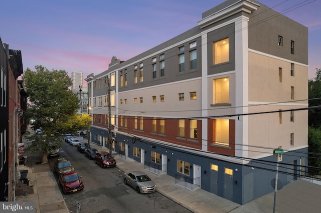 view of outdoor building at dusk