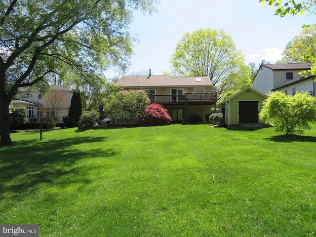 view of yard with a shed and a wooden deck