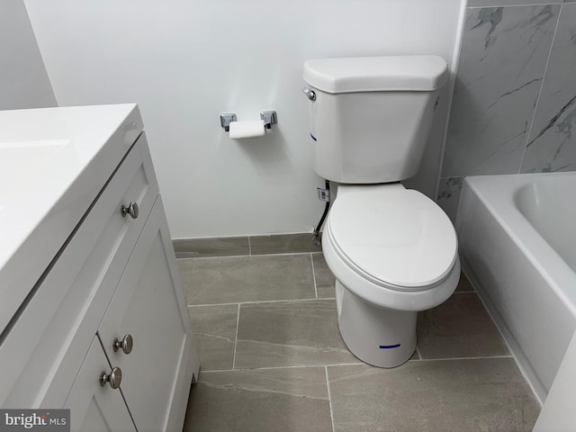 full bath featuring toilet, vanity, and a tub to relax in